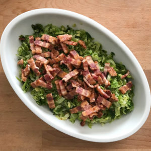 Brussels sprouts side dish salad with bacon on top