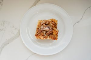slice of french toast casserole on white dish